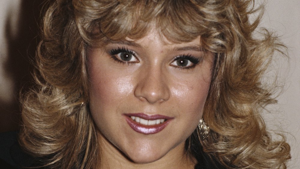 Samantha Fox in giacca di pelle nera, sorridente ad una premiazione nel 1986