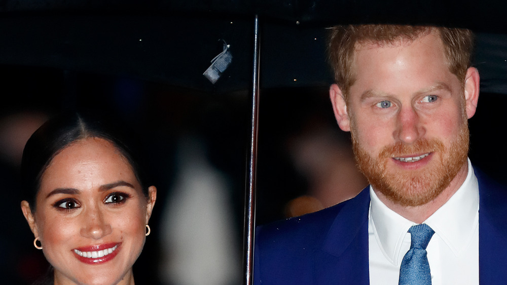 Meghan Markle e l'ombrello del principe Harry