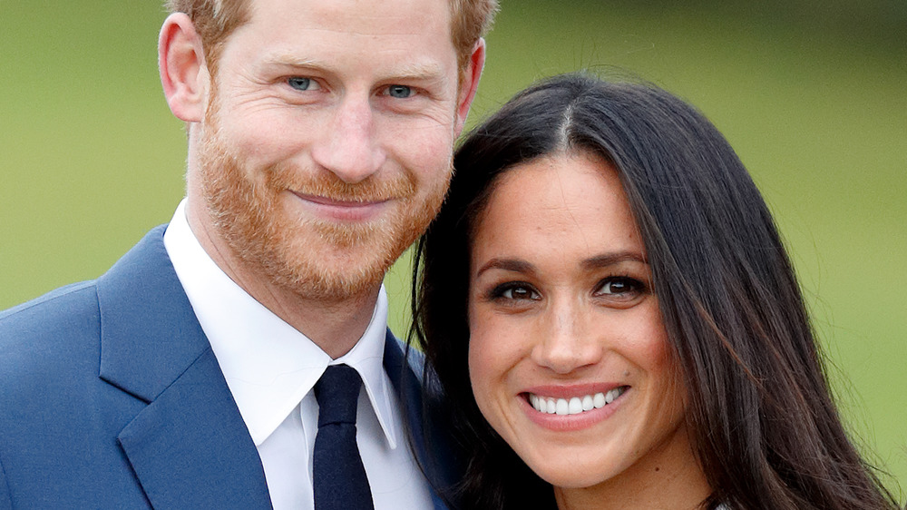 Il principe Harry e Meghan Markle sorridono 