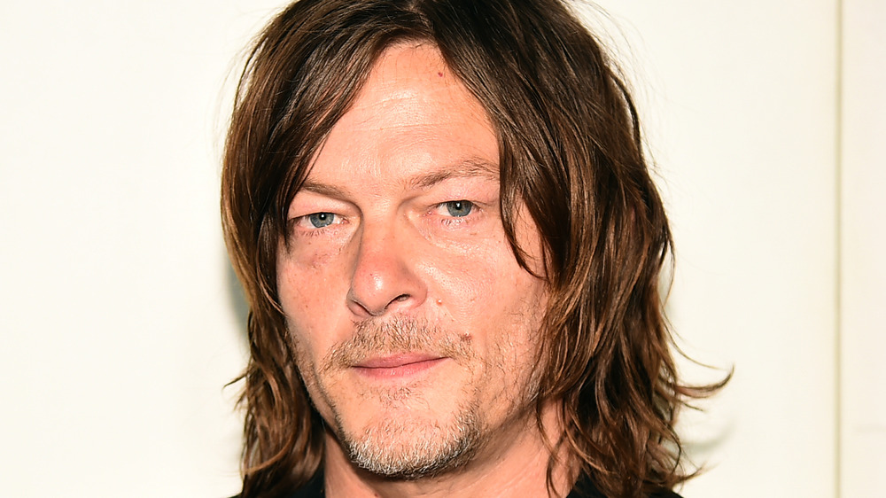 Norman Reedus sorrideva