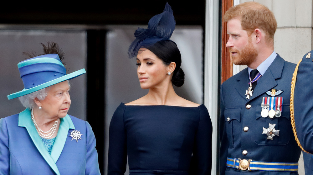 La regina Elisabetta II, Meghan Markle, il principe Harry Buckingham Palace