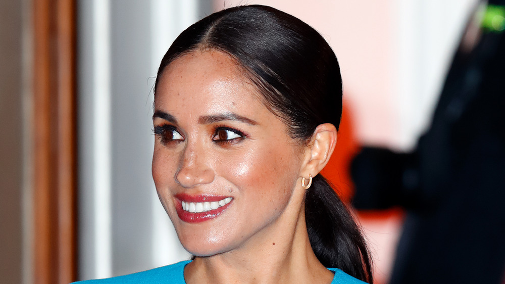 Meghan Markle sorride per le telecamere