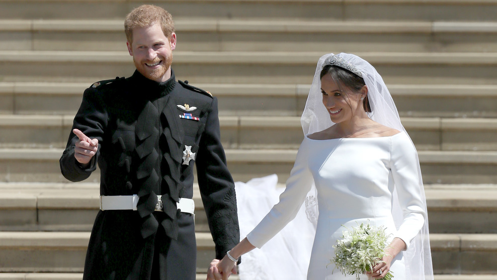 Il principe Harry e Meghan Markle sorridono il giorno del matrimonio