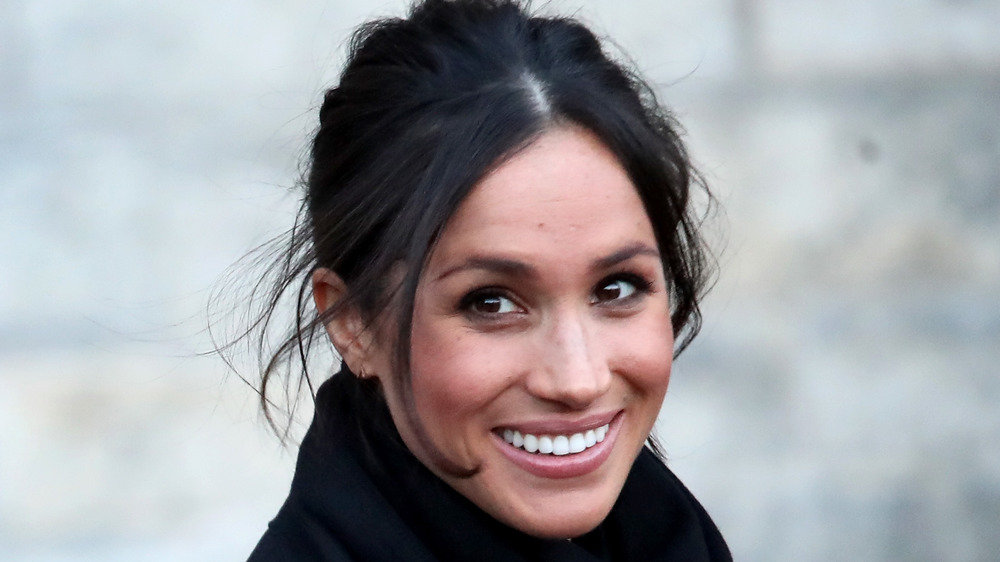 Meghan Markle sorride per le telecamere