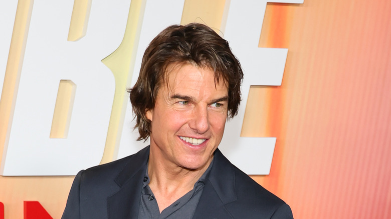 Tom Cruise maglietta grigia Mission Impossible
