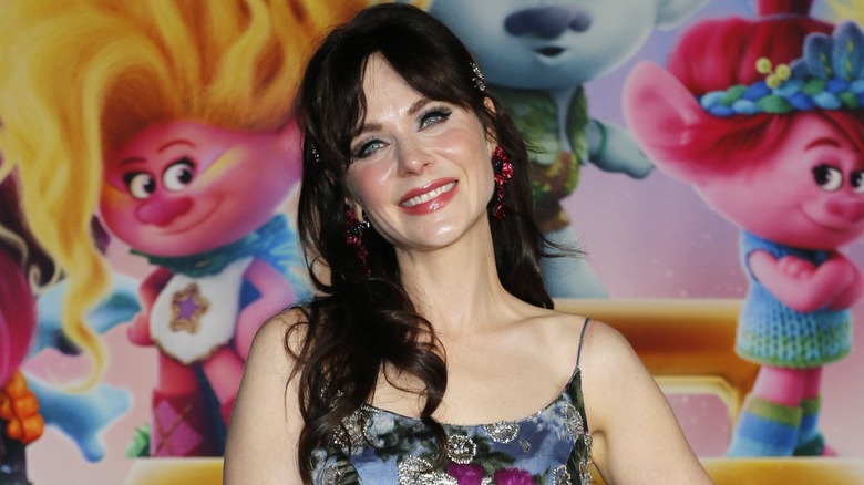 Acconciatura con frangia a tendina di Zooey Deschanel