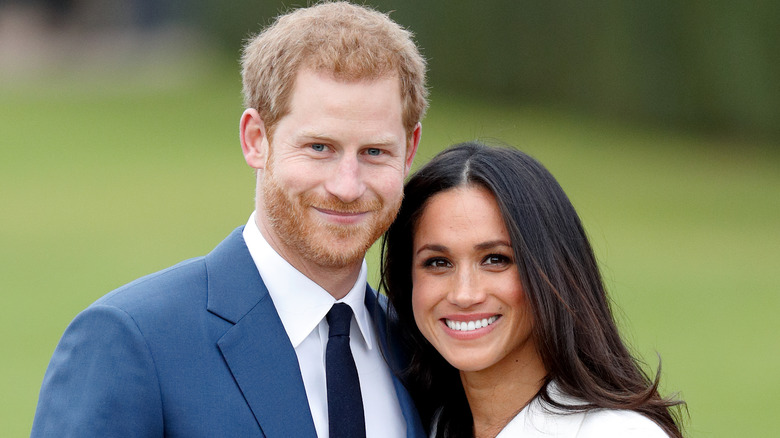 Il principe Harry e Meghan Markle sorridono