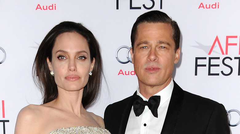  Angelina Jolie Brad Pitt con aria severa sul red carpet