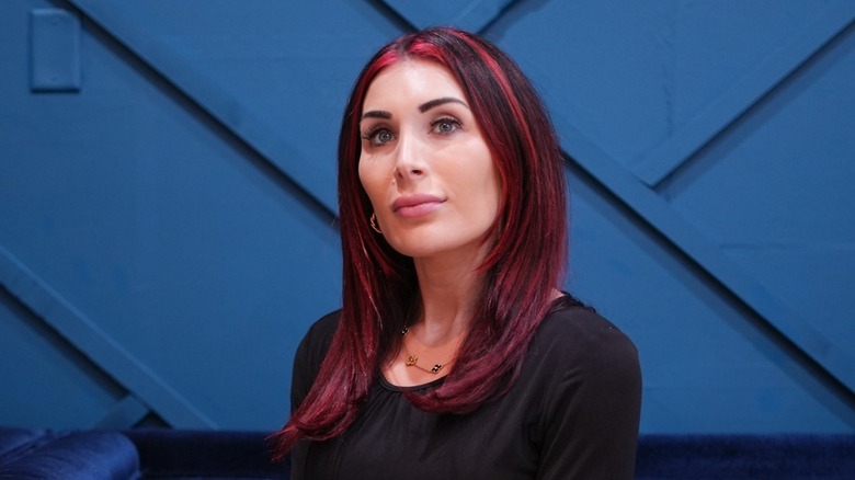 Laura Loomer con i capelli rossi che sorride