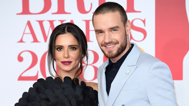 Cheryl Cole e Liam Payne sorridono